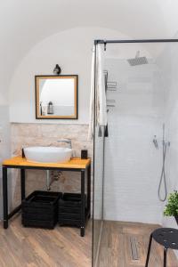 a bathroom with a sink and a shower at Sfumature di Puglia in Turi