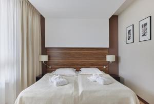 Posteľ alebo postele v izbe v ubytovaní Hotel Diva SPA