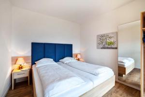 Posteľ alebo postele v izbe v ubytovaní Gartenheim App Maria