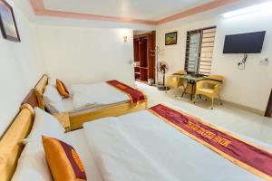 Giường trong phòng chung tại Minh Thanh Sa Pa Hotel