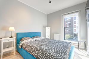 Posteľ alebo postele v izbe v ubytovaní Dom & House - Apartments Chmielna Park