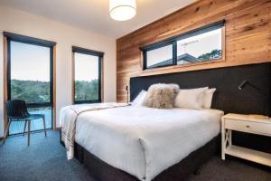 Säng eller sängar i ett rum på Baden House - Freycinet Holiday Houses