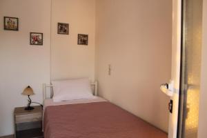 Posteľ alebo postele v izbe v ubytovaní Dimokritos Apartment