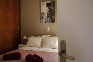 Posteľ alebo postele v izbe v ubytovaní Dimokritos Apartment