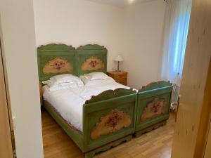 Postel nebo postele na pokoji v ubytování Maso Genziana