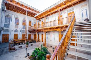 a large building with a staircase in the middle at Boutique Old City in Bukhara