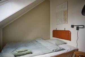 En eller flere senge i et værelse på Hotel Villa Gulle