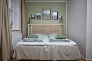 A bed or beds in a room at Hotel Villa Gulle