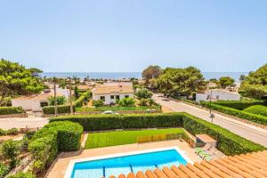 an aerial view of a house with a swimming pool at Villa Pepita in Binibeca