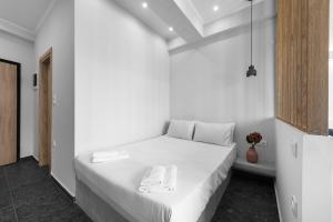 Кровать или кровати в номере WallStreet, The Luxury Suites