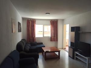 Televízia a/alebo spoločenská miestnosť v ubytovaní TORRE ATALAYA House