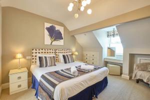 En eller flere senge i et værelse på Grassington Lodge