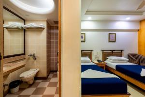 Postel nebo postele na pokoji v ubytování Hotel Balwas International
