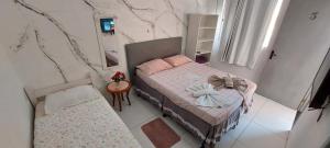 Postel nebo postele na pokoji v ubytování Guest House Palmeiras + 20 fotografií