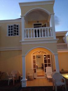 a large house with a balcony and a porch at Villa Pereybere #2 in Pereybere