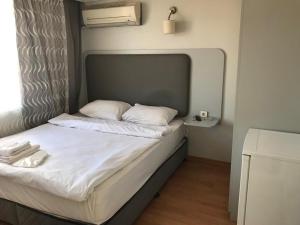 Postel nebo postele na pokoji v ubytování Emin Konak Hotel