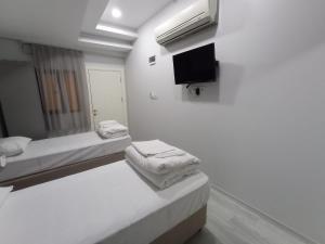 Postel nebo postele na pokoji v ubytování Emin Konak Hotel