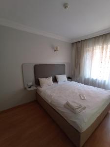 Postel nebo postele na pokoji v ubytování Emin Konak Hotel