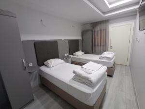 Postel nebo postele na pokoji v ubytování Emin Konak Hotel