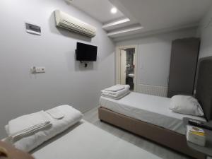 Postel nebo postele na pokoji v ubytování Emin Konak Hotel