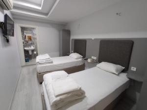 Postel nebo postele na pokoji v ubytování Emin Konak Hotel