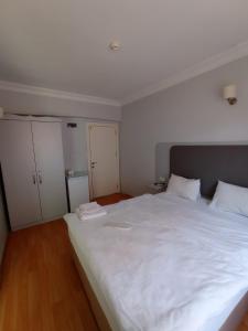 Postel nebo postele na pokoji v ubytování Emin Konak Hotel