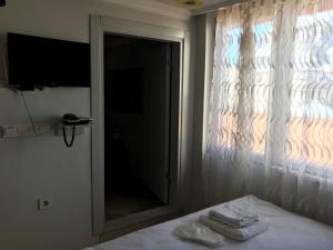 Postel nebo postele na pokoji v ubytování Emin Konak Hotel