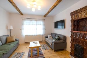 a living room with a couch and a table at Cabana Bucuria Munților in Horea