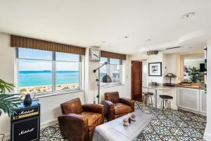 a living room with a view of the ocean at National Hotel, An Adult Only Oceanfront Resort in Miami Beach