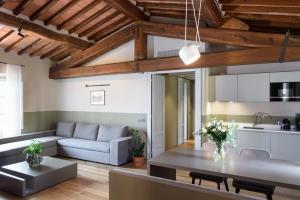 a living room with a couch and a table at Laqua Vineyard in Terricciola