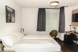 Postel nebo postele na pokoji v ubytování Dihei - Hotel, Lounge, Bar