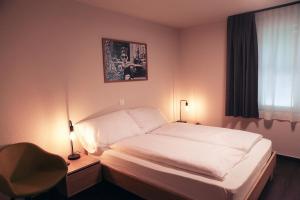 Postel nebo postele na pokoji v ubytování Dihei - Hotel, Lounge, Bar