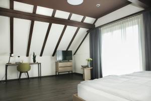 Postel nebo postele na pokoji v ubytování Dihei - Hotel, Lounge, Bar