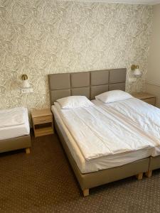 Łóżko lub łóżka w pokoju w obiekcie GRACJA