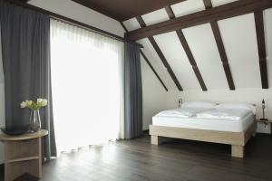 Postel nebo postele na pokoji v ubytování Dihei - Hotel, Lounge, Bar