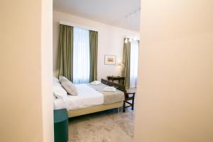 A bed or beds in a room at Migliori Olive Ascolane beds