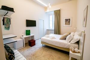A bed or beds in a room at Migliori Olive Ascolane beds