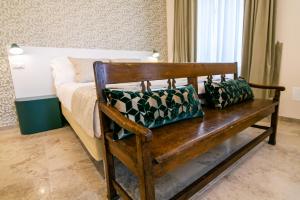 A bed or beds in a room at Migliori Olive Ascolane beds
