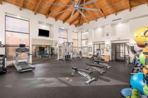 a gym with several treadmills and machines in a room at Pure Suites Furnished 1, 2 and 3 Bed Apts Pool Gym Scottsdale Quarter in Scottsdale