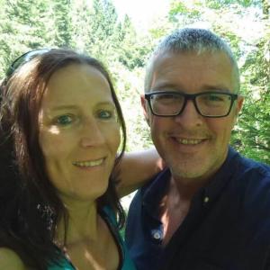 a man and a woman posing for a picture at Opas Bergchalet in Halblech