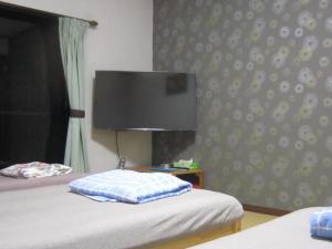 Postel nebo postele na pokoji v ubytování Minato Oasis Numazu / 沼津観光の中心、伊豆観光の拠点に好立地！沼津港に位置し交通・飲食・コンビニ等至便です！