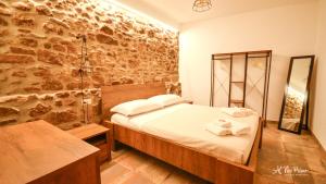 A bed or beds in a room at Al Vico Primo - Boutique Apartment