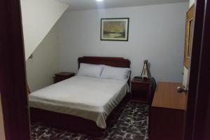 Postel nebo postele na pokoji v ubytování Hotel Alcayata Popayan