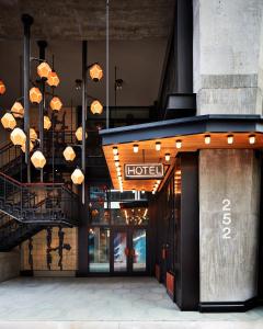 a hotel building with a hotel sign hanging from the ceiling at Ace Hotel Brooklyn in Brooklyn