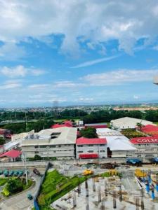 a group of buildings with red and white roofs at Studio Type Condo with WiFi in Biñan