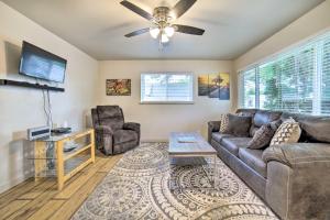 a living room with a couch and a ceiling fan at Cozy Townhome Near Dtwn, Hospital and College! in Pocatello