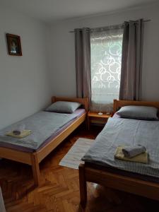 Postel nebo postele na pokoji v ubytování Guest House Josipović