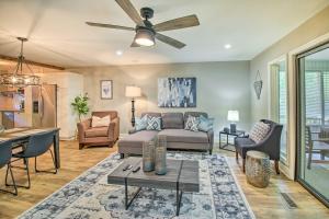 a living room with a couch and a ceiling fan at Updated Townhome with Deck, Grill and Sunroom! in Hot Springs Village