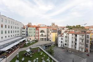 a view of a city with buildings at Palácio das Cardosas Studio by LovelyStay in Porto