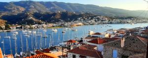 a view of a harbor with boats in the water at Traditional house with sea view ''MYLOS'' in Poros